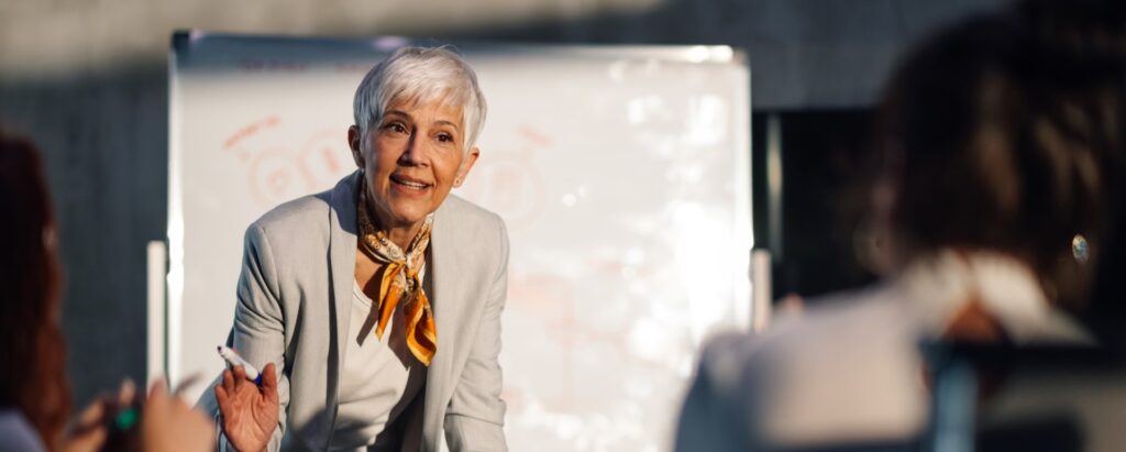 A senior HR professional in a workforce planning meeting