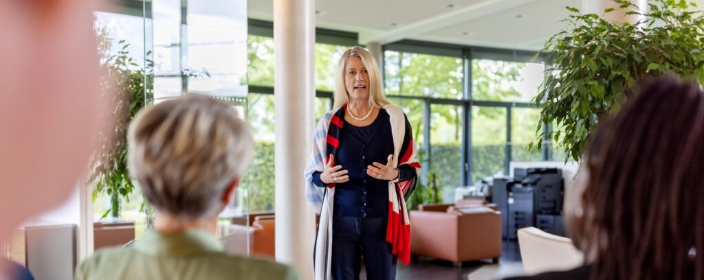 An ESG and sustainability strategy leader speaking during a business discussion